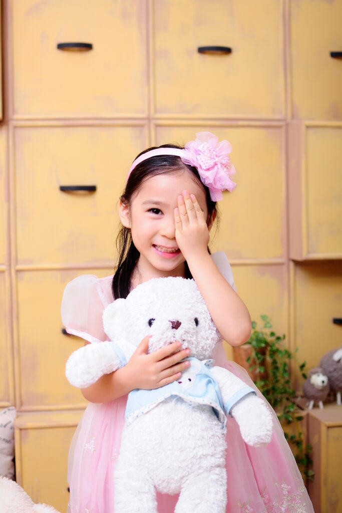 little girl with teddy bear