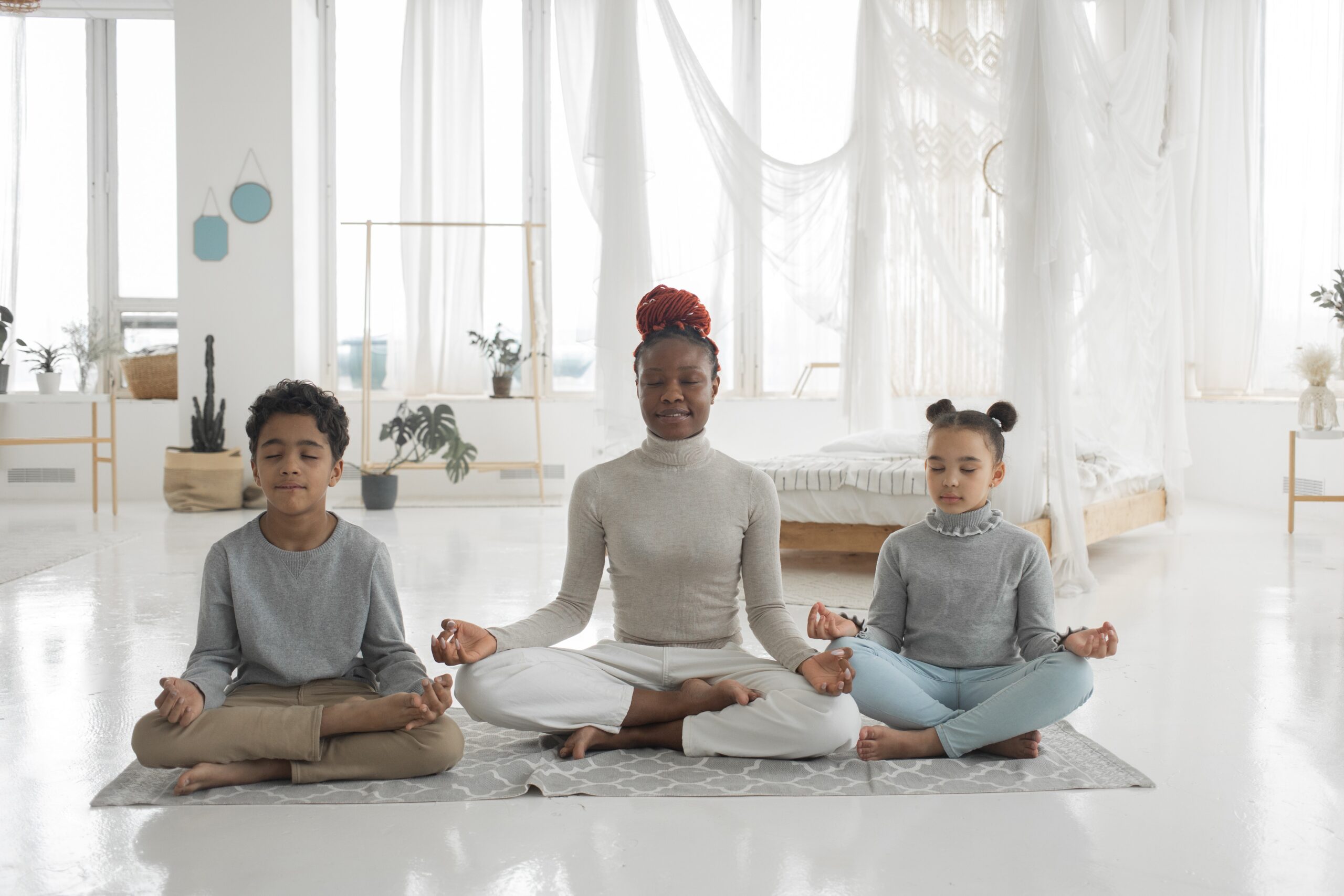 mother meditating with kids